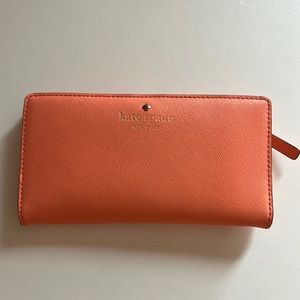 Kate spade coral wallet with polka dot lining